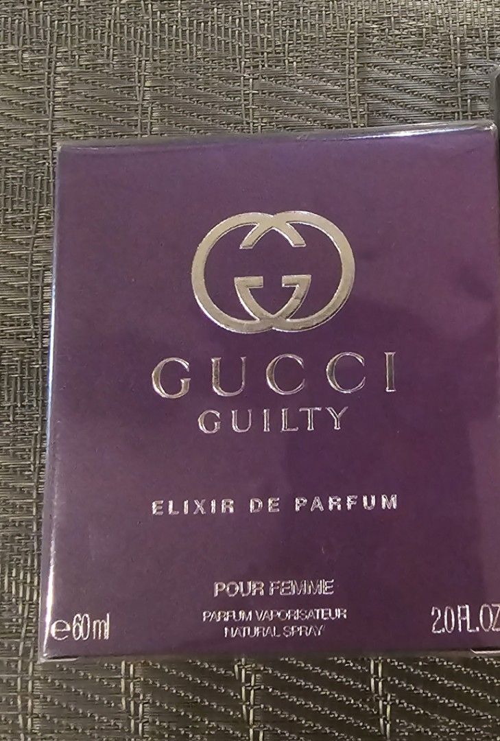Gucci Guilty Elixir de Parfum Pour Femme 60ml (Category: Fragrance & Deodorants) located in Manila. Submitted by prelovedfindsxoxo (Listing ID 1470587576, Image 1). Description: - Authentic Gucci Guilty Elixir de Parfum Pour Femme - Volume: 60ml / 2.0 fl oz - Highly concentrated and long-lasting formula - Gorgeous purple glass bottle with matching purple box - Brand new and sealed packaging - Perfect as a gift or for personal use - Selling below 