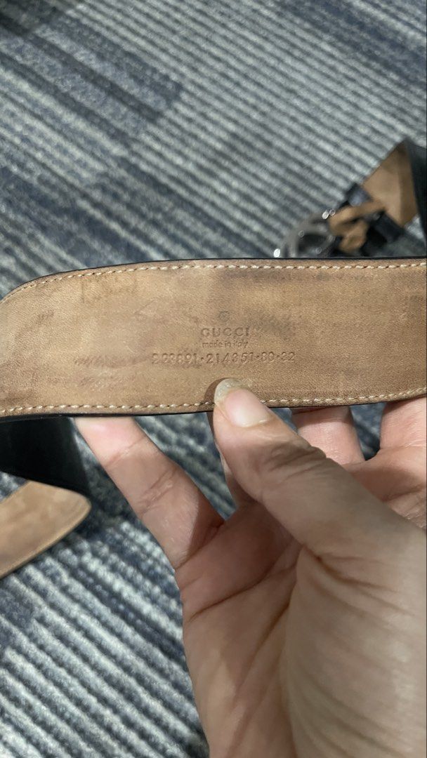Gucci Interlocking G Black GG Monogram Belt (Category: Belts) located in Rizal. Submitted by annelimited_stuffs (Listing ID 1470670183, Image 2). Description: Authentic Gucci interlocking G belt in black monogram canvas. Dark gunmetal buckle with noticeable scratches on the surface. Backside shows normal wear, tanning, and minor discoloration. Serial number stamped near the interior end reads 223891 214351 80 32. Standard holes punched for sizing