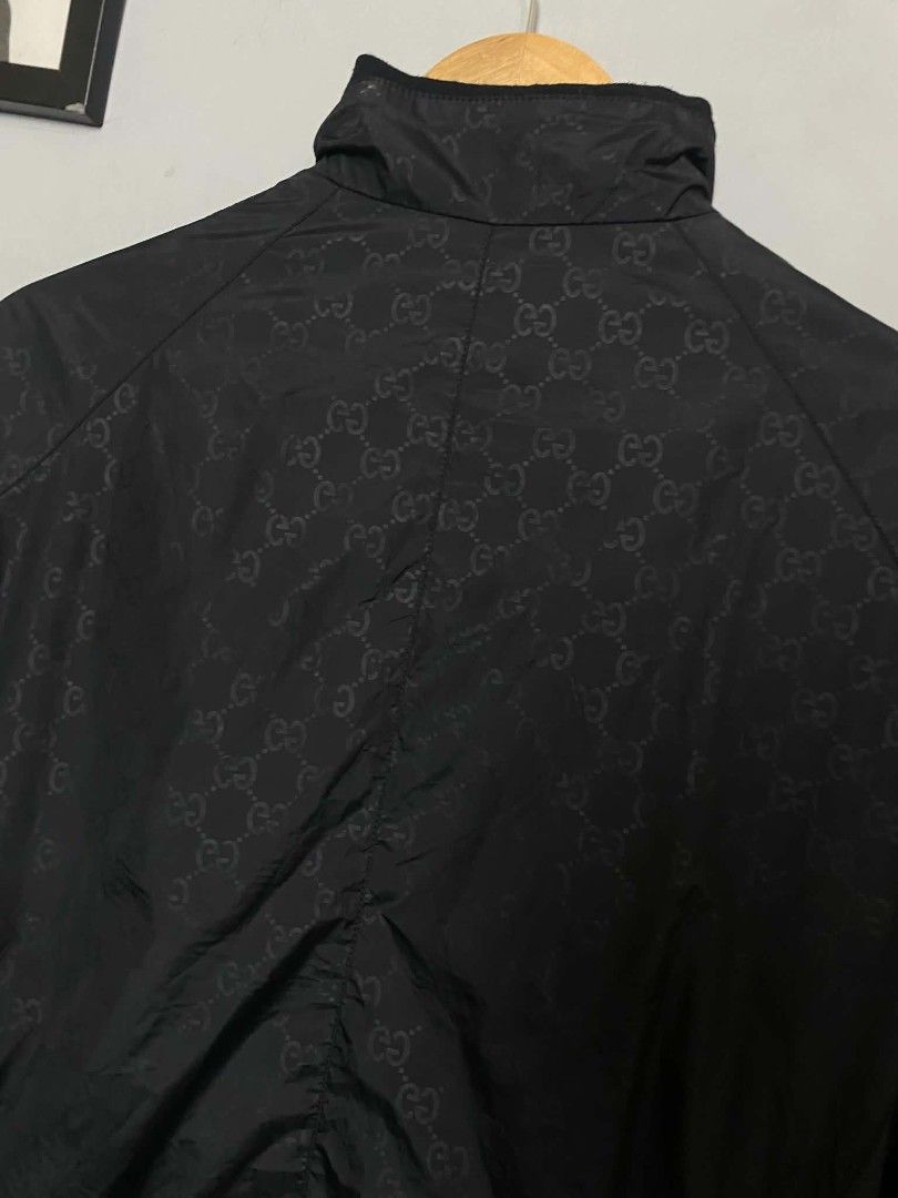 Gucci Monogram Black Nylon Zip-Up Jacket Size 50 (Category: Coats, Jackets and Outerwear) located in Manila. Submitted by arjay_cuayzon2 (Listing ID 1470629888, Image 3). Description: - Brand: Gucci - Item: Black GG Monogram Zip Jacket - Size: 50 (Made in Italy) - Material: Premium nylon with inner lining - Design details: All-over GG monogram, signature green & red striped ribbed hem, high collar, and chest patch emblem - Hardware: Full zip fron