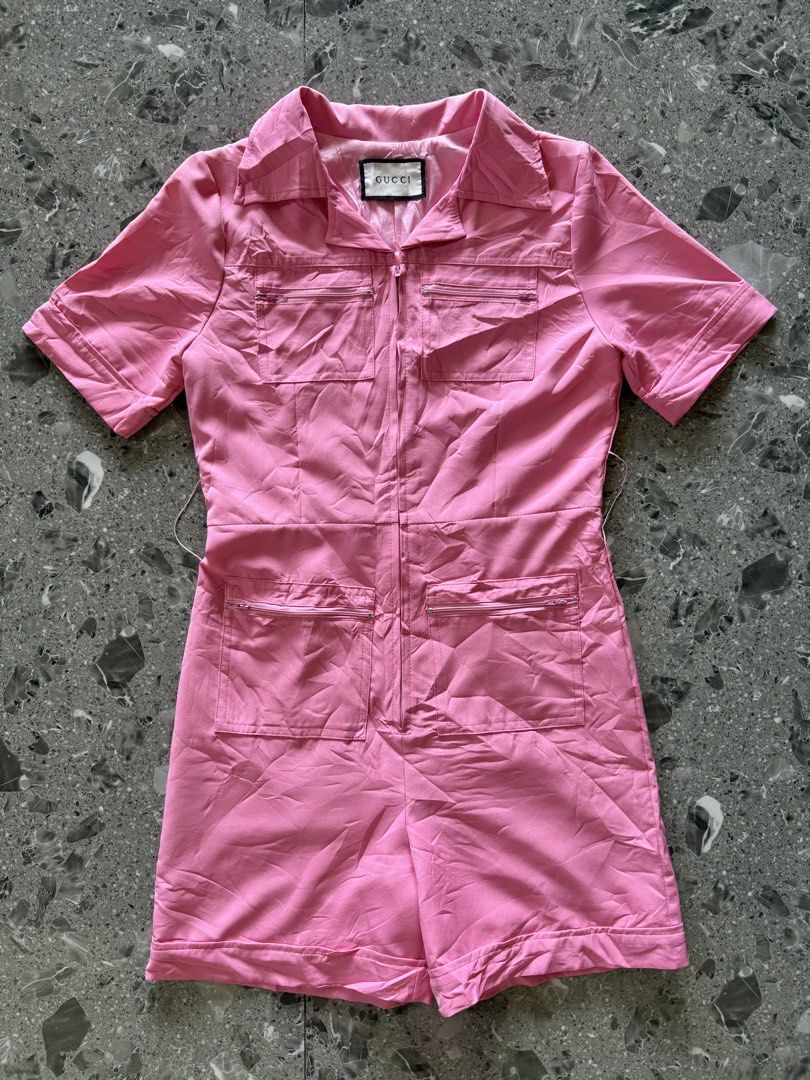 Gucci Pink Cotton Zip Romper Playsuit (Category: Rompers) located in Cebu City. Submitted by stylingtrends.coll (Listing ID 1470583551, Image 1). Description: - missing belt - Color: Bright Pink🌸💖 - Design: Collared neckline with front zipper closure - Pockets: 4 functional zip pockets (chest and shorts) Size: Medium.
