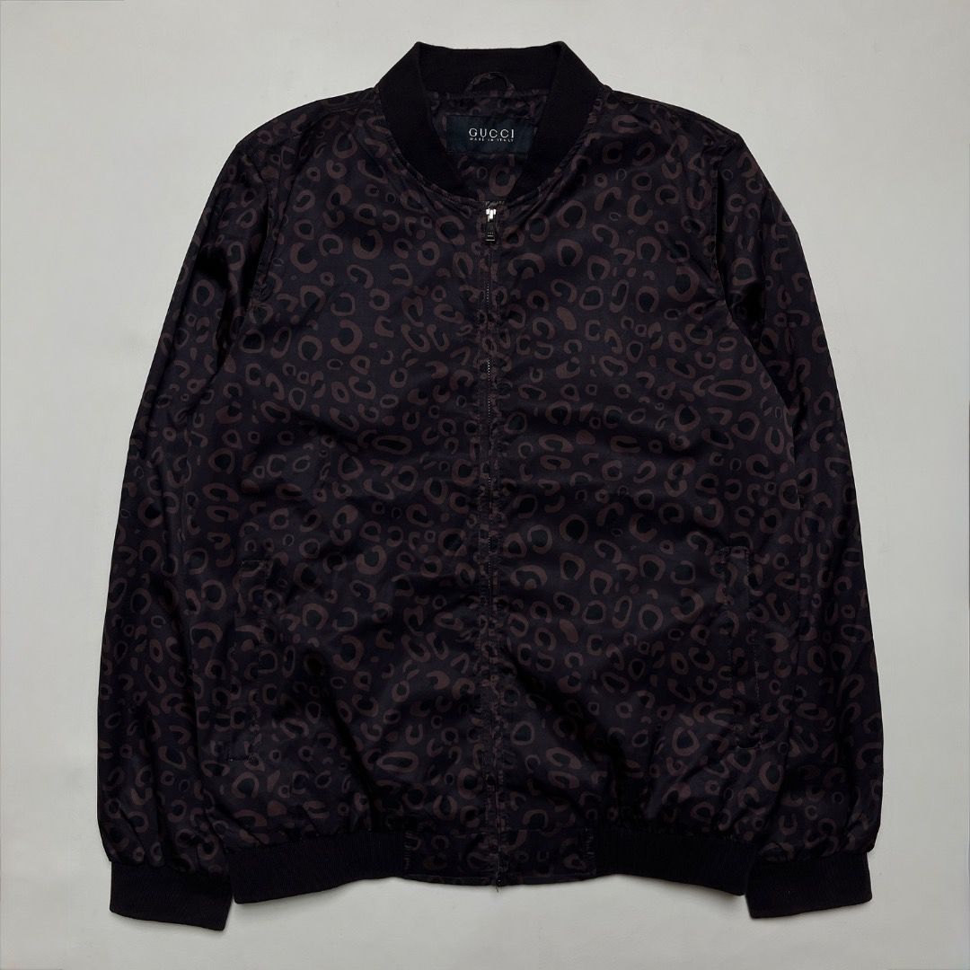 Gucci Tom Ford Bomber Jacket Brown Pattern (Category: Coats, Jackets and Outerwear) located in Caloocan City. Submitted by achilles_grails (Listing ID 1470594681, Image 1). Description: - Gucci bomber jacket with striking dark brown animal print - Comfortable black ribbed collar, cuffs, and hem - Secure front zip closure - Clean interior lining with official Gucci branding and model code 318182 Z7773 - Premium designer piece, perfect for making a
