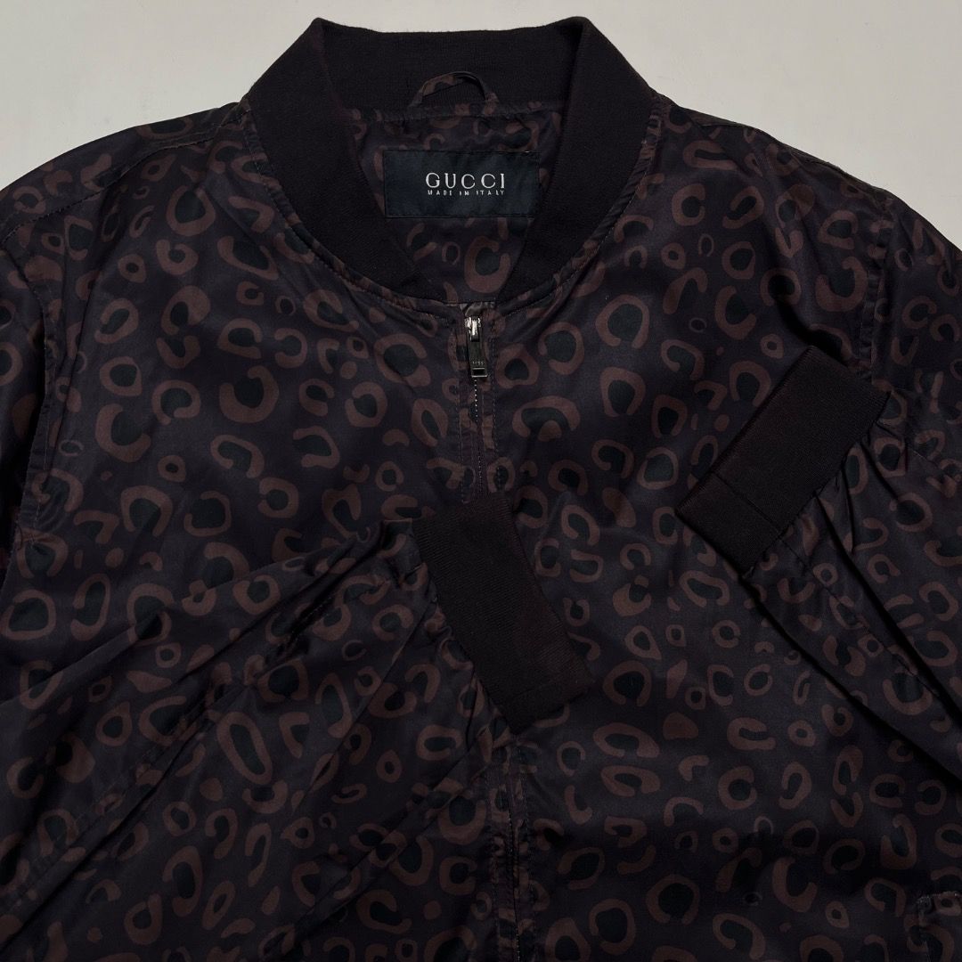 Gucci Tom Ford Bomber Jacket Brown Pattern (Category: Coats, Jackets and Outerwear) located in Caloocan City. Submitted by achilles_grails (Listing ID 1470594681, Image 2). Description: - Gucci bomber jacket with striking dark brown animal print - Comfortable black ribbed collar, cuffs, and hem - Secure front zip closure - Clean interior lining with official Gucci branding and model code 318182 Z7773 - Premium designer piece, perfect for making a