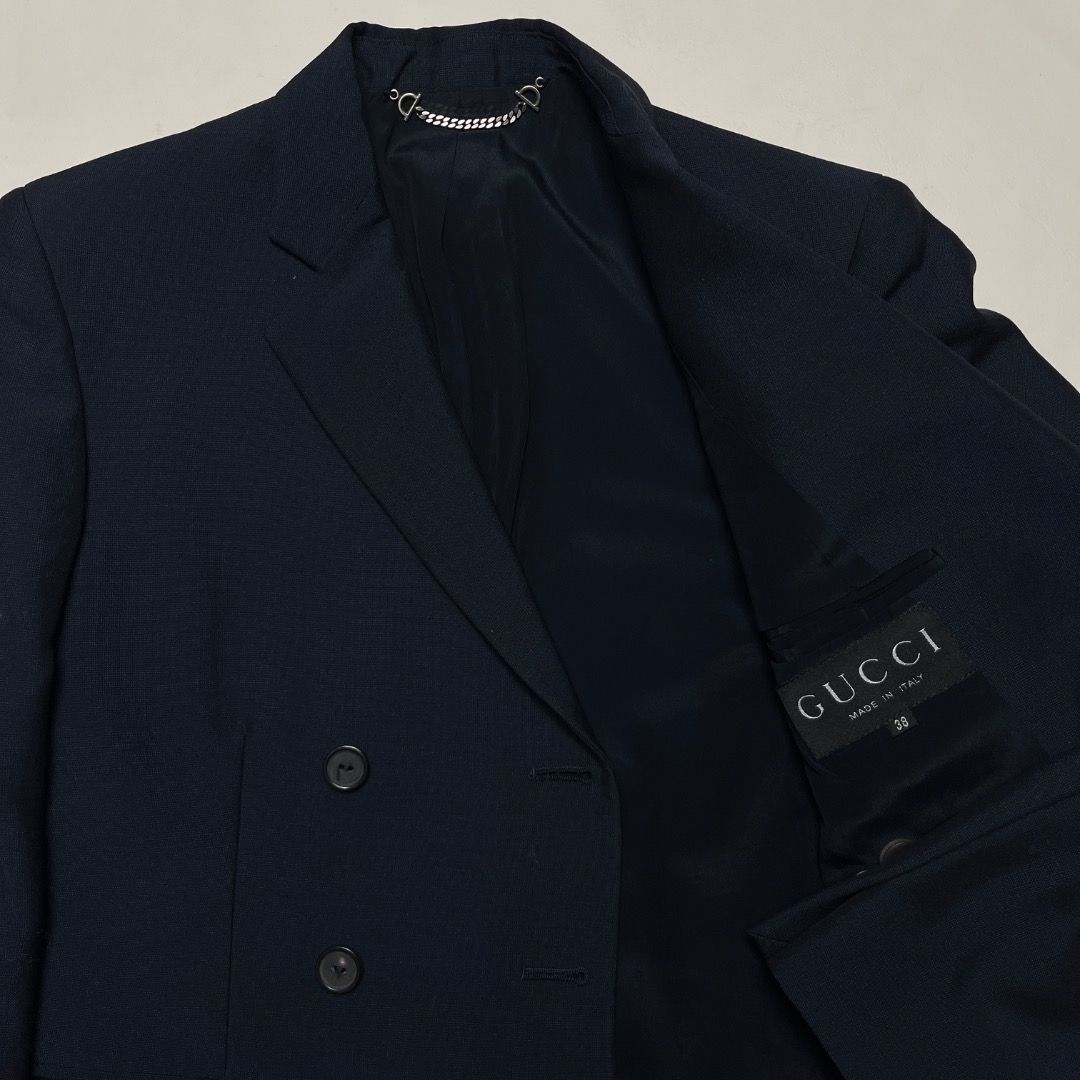 Gucci Tom Ford Double-Breasted Navy Blazer Size 38 (Category: Coats, Jackets and Outerwear) located in Caloocan City. Submitted by achilles_grails (Listing ID 1470603647, Image 2). Description: - Brand: Gucci - Style: Double-breasted blazer - Color: Dark Navy - Size: 38 (tag inside pocket) - Details: Structured shoulders, peak lapels, front flap pockets, lined interior with collar chain detail - Condition: Excellent - Perfect for: Professional, f