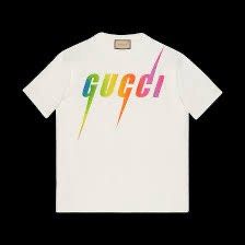 Gucci White & Multicolor Blade Logo T-Shirt (Category: Tshirts & Polo Shirts ) located in Angeles City. Submitted by royal_vintage_thriftshop (Listing ID 1470650166, Image 2). Description: Gucci White & Multicolor Blade Logo T-Shirt No name tag Only washtag Oversize Large Chest 21, Length 28.