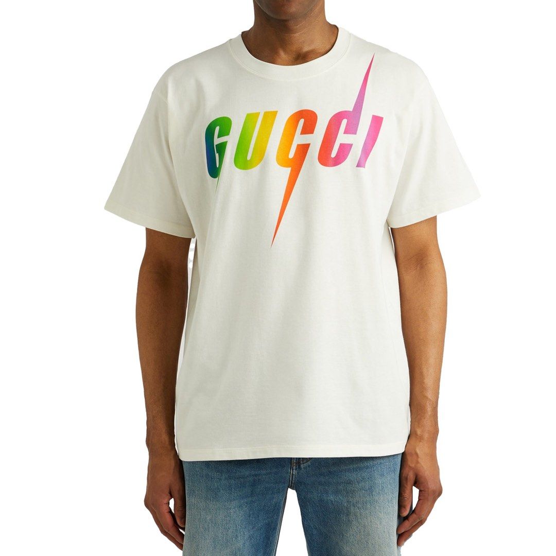 Gucci White & Multicolor Blade Logo T-Shirt (Category: Tshirts & Polo Shirts ) located in Angeles City. Submitted by royal_vintage_thriftshop (Listing ID 1470650166, Image 1). Description: Gucci White & Multicolor Blade Logo T-Shirt No name tag Only washtag Oversize Large Chest 21, Length 28.