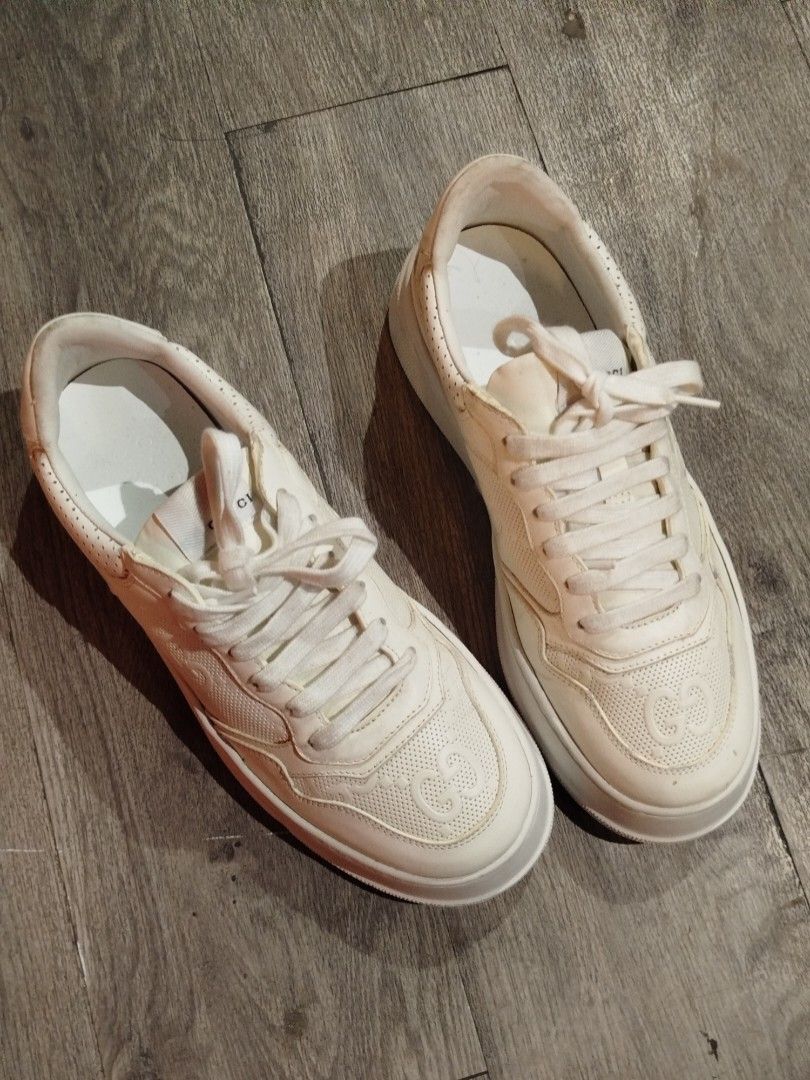 Gucci White Leather Platform Sneakers with Interlocking G (Category: Sneakers) located in Quezon City. Submitted by epoquebyjaz (Listing ID 1470632209, Image 3). Description: - Brand: Gucci - Style: White Leather Platform Sneakers - Details: All-over perforated design with embossed interlocking G monogram - Features: Thick platform sole with Gucci lettering on the heel, gold-printed interlocking G logo at the heel tab, branded tongue tag - Origin