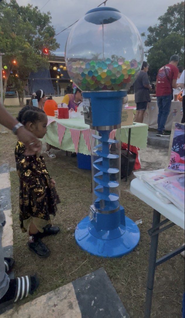 GUMBALL MACHINE PARTY RENTAL! (Category: Educational & Learning Toys) located in Cavite. Submitted by AlwaysGiveBack (Listing ID 1470573253, Image 1). Description: GUMBALL MACHINE PARTY RENTAL! Make your next party a hit with our vintage-style Gumball / Toy Vending Machine rental! Comes complete with free-play coins so your guests can spin for treats all party long! 🍬✨ RATES & PACKAGES: 🔴 Starter (100 Pcs): ₱2,000 🟡 Standard (200 Pcs): ₱3,400 