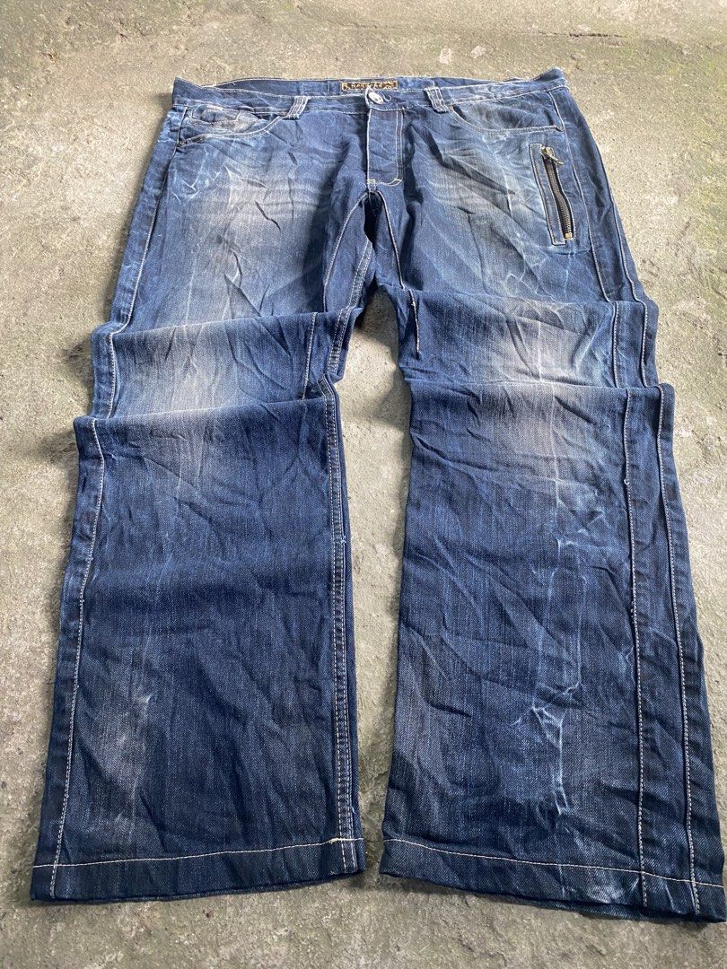 Hacker Jeans Dark Blue Distressed Denim Zip Pocket (Category: Jeans) located in Caloocan City. Submitted by remythrift (Listing ID 1470589986, Image 1). Description: - Color: Dark blue with heavy pre-wash fading and distressing - Pockets: Distinctive zipper pocket on front left thigh and zipped back pockets - Fit & Style: Straight leg cut, structured multi-panel leg stitching, and raw hems - Details: Classic button closure with intact belt loops 