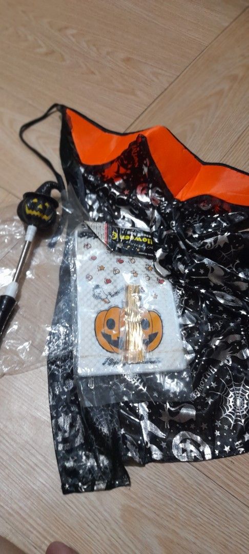 Halloween Bundle Set (Category: Occasions & Party Supplies) located in Bocaue. Submitted by marajapansurplus (Listing ID 1470660036, Image 1). Description: - All-in-one Halloween party bundle ready for trick-or-treating or hosting - stylish silver pumpkin and spiderweb prints cape - pack of festive pumpkin napkins paired with golden picks - Handheld jack-o-lantern witch hat wand with a playful, flexible spring metal shaft ( as is condition, untes