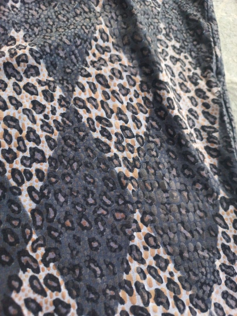 Halter neck leopard print sleeveless top (Category: Sleeveless) located in Davao. Submitted by bloodyriz (Listing ID 1470647267, Image 2). Description: - Color: Grey and black - Design: All-over leopard print - Style: Sleeveless, fitted, halter neck with tie straps - Fabric: Lightweight and comfortable - Versatile: Easy to pair with jeans or skirts for a casual day out.