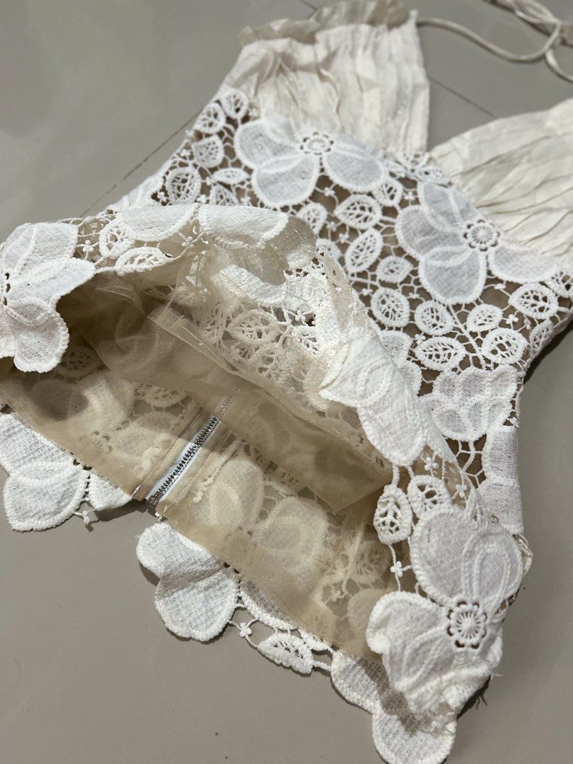 Halter top (Category: Others Tops) located in Davao. Submitted by scorp5 (Listing ID 1470687065, Image 3). Description: off-white halter top features a deep V-neckline with pleated fabric cups and a sheer floral lace appliqué body..