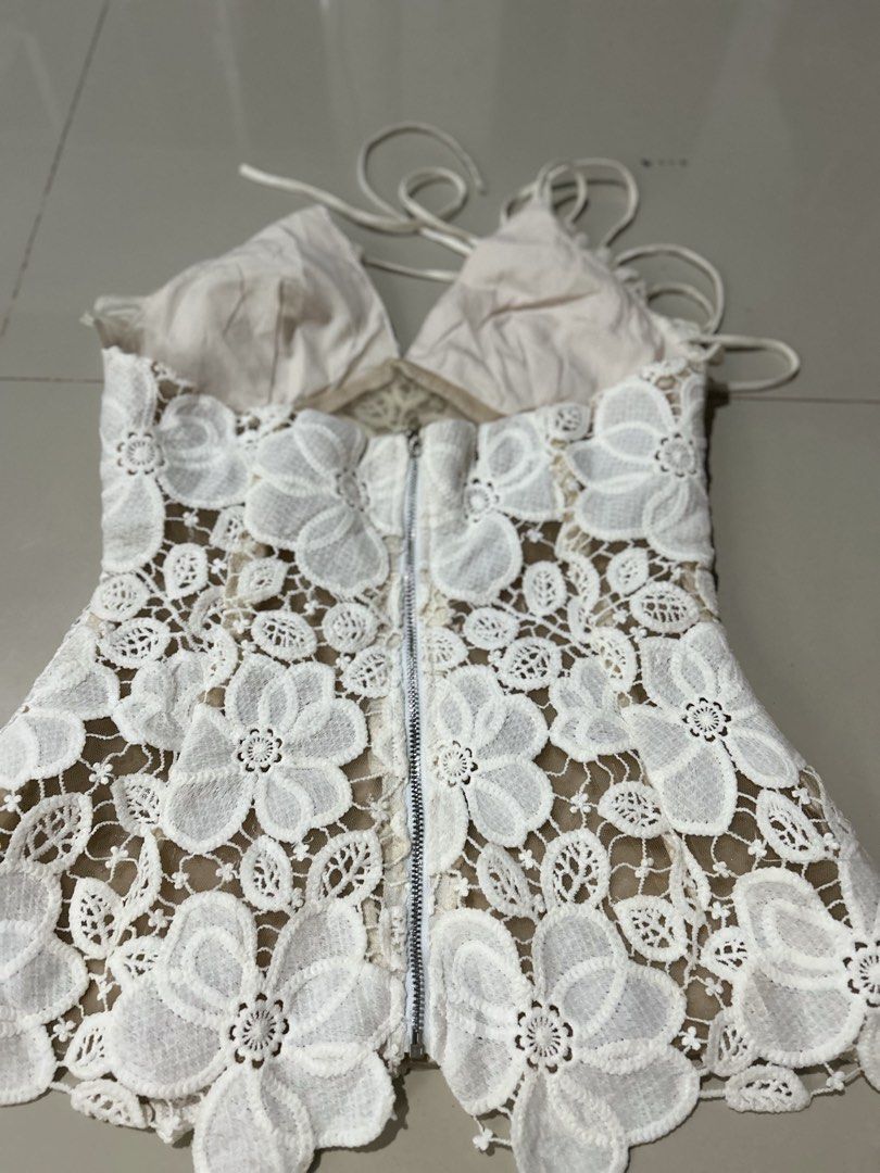 Halter top (Category: Others Tops) located in Davao. Submitted by scorp5 (Listing ID 1470687065, Image 2). Description: off-white halter top features a deep V-neckline with pleated fabric cups and a sheer floral lace appliqué body..