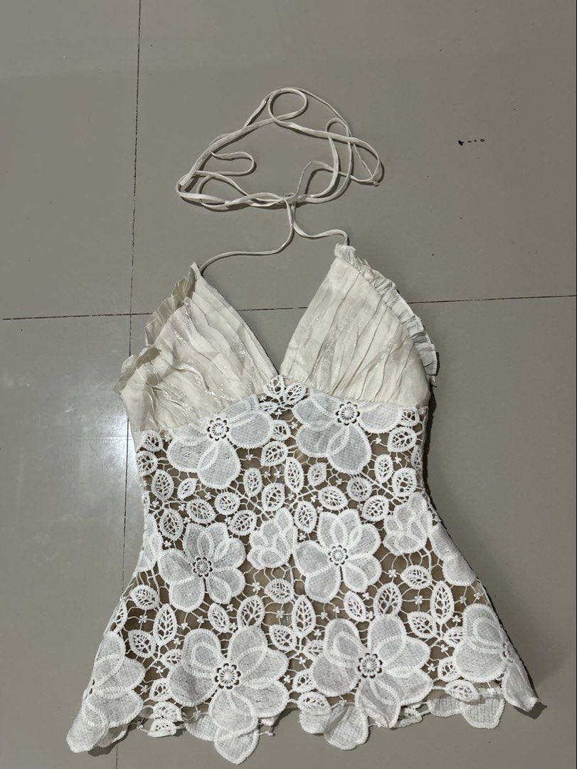 Halter top (Category: Others Tops) located in Davao. Submitted by scorp5 (Listing ID 1470687065, Image 1). Description: off-white halter top features a deep V-neckline with pleated fabric cups and a sheer floral lace appliqué body..