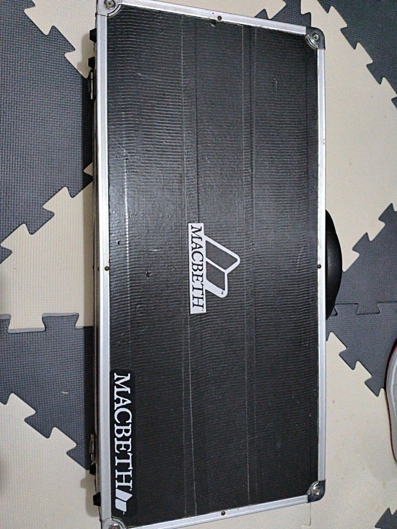 Hard Carrying Case (Category: Cases & Sleeves) located in Manila. Submitted by eediso10 (Listing ID 1470622871, Image 1). Description: - Color: Black with silver metal trimming and reinforced corners - Exterior: Textured finish with dual white Macbeth branding logos - Hardware: Heavy-duty side latches - Portability: Sturdy black handle for easy carrying - Condition: Good protective storage option.