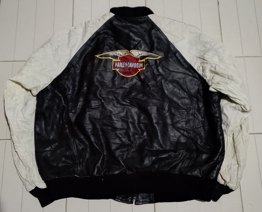 Harley Davidson Leather Bomber Jacket Black White Size L (Category: Coats, Jackets and Outerwear) located in Manila. Submitted by warmcloud-06f3 (Listing ID 1470651189, Image 1). Description: - Brand: Harley Davidson - Style: Classic leather bomber jacket / Biker style - Colorway: Black and white - Logos: Embroidered bar and shield on the front, eagle logo on the back - Features: Front zip closure, side pockets, metal chain locker loop - Details: