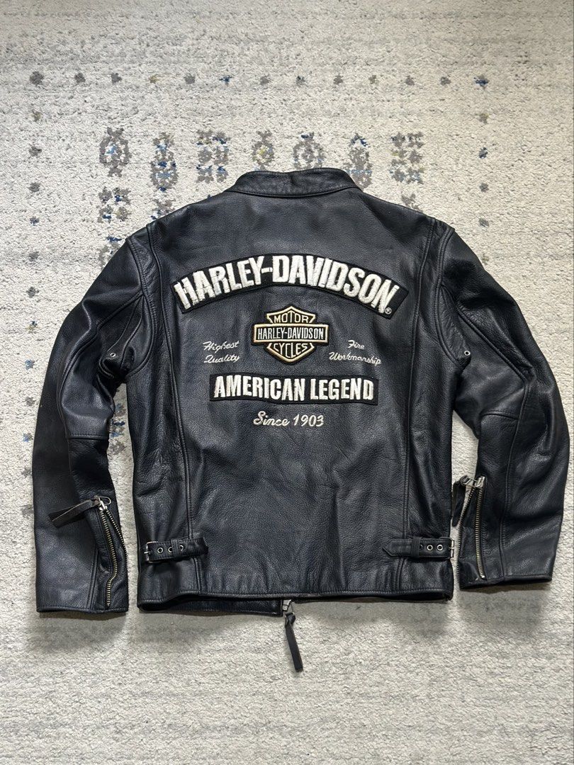 Harley-Davidson American Legend Leather Jacket (Category: Coats, Jackets and Outerwear) located in Daet. Submitted by thrifthings2018 (Listing ID 1470629131, Image 1). Description: - Authentic black Harley-Davidson leather jacket - Heavyweight genuine leather with warm quilted lining - Large embroidered American Legend and Bar & Shield back graphic - Smaller embroidered logo on the left chest - Functional features: zip pockets, zippered cuffs, sn