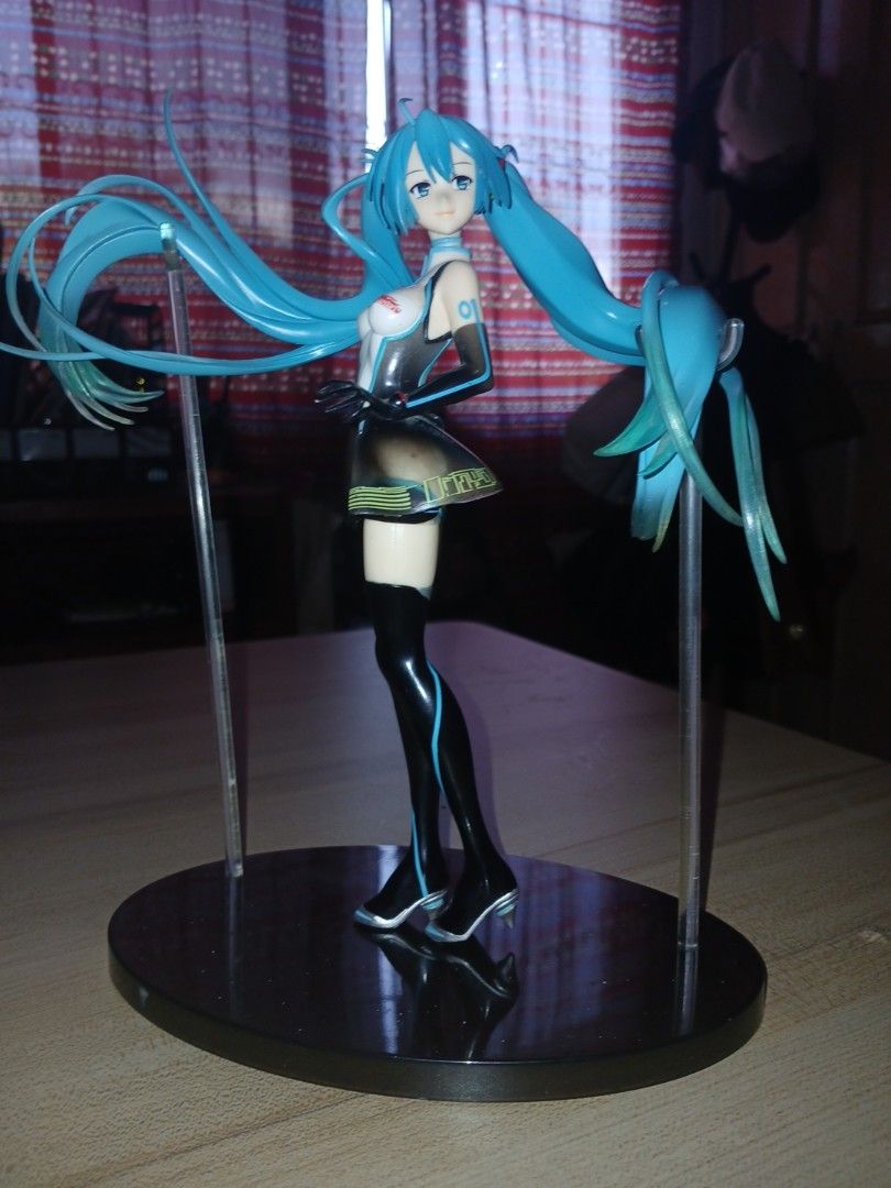 Hatsune Miku Racing Figure with Stand (Category: Figurines & Statues) located in Caloocan City. Submitted by channceylowwe (Listing ID 1470559848, Image 1). Description: - Authentic Hatsune Miku collectible figure - Features iconic long turquoise twin-tails with translucent green tips - Mounted on a sturdy black circular base slightly scratches but in good condition - Highly detailed coloring throughout only few discoloration but in Perfect addit