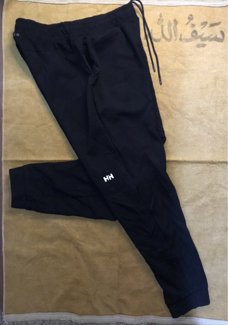 Helly Hansen Black Men Sweatpants Joggers Size XL (Category: Joggers) located in Mati. Submitted by abu_razmey (Listing ID 1470729274, Image 2). Description: - Brand: Helly Hansen - Size: Men's XL - Color: Black - Adjustable drawstring waist with branded metal tips - Iconic HH logo printed on the left leg and back waistband - Cuffed ankles for a stylish tapered fit - Comfortable everyday athletic wear - Condition: Brand new / Excellent quality.