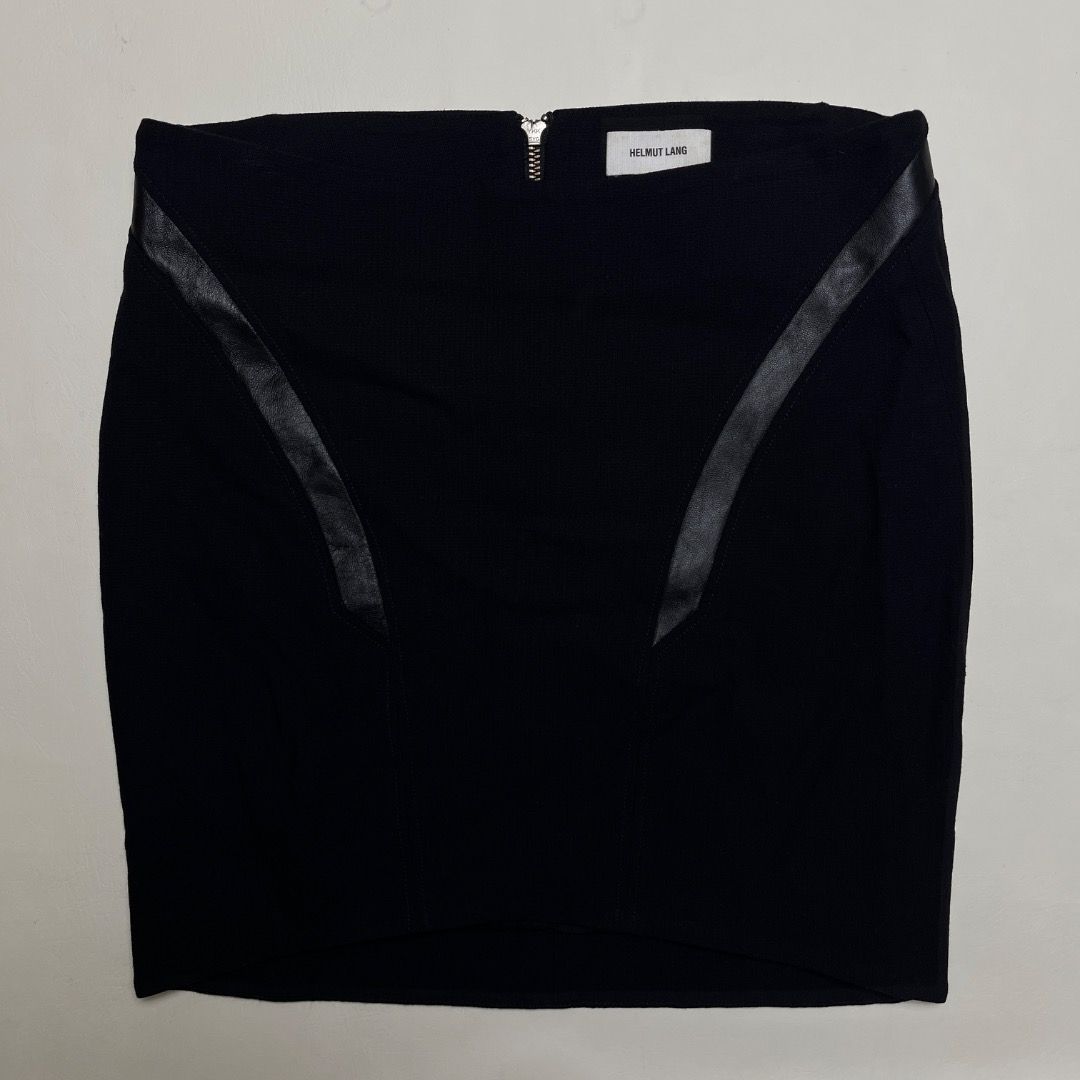 Helmut Lang Black Wool Leather Trim Mini Skirt Size 2 (Category: Skirts) located in Caloocan City. Submitted by achilles_grails (Listing ID 1470596799, Image 1). Description: - Brand: Helmut Lang - Color: Black - Size: 2 (Made in USA) - Material: Virgin wool blend with real leather trim - Lining: Silk blend - Closure: Exposed back zip - Condition: Sleek designer piece with great structural lines.