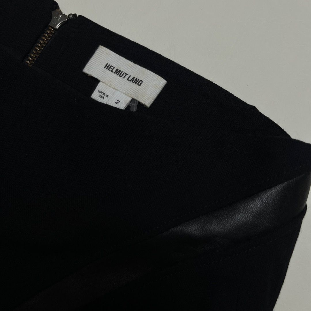 Helmut Lang Black Wool Leather Trim Mini Skirt Size 2 (Category: Skirts) located in Caloocan City. Submitted by achilles_grails (Listing ID 1470596799, Image 2). Description: - Brand: Helmut Lang - Color: Black - Size: 2 (Made in USA) - Material: Virgin wool blend with real leather trim - Lining: Silk blend - Closure: Exposed back zip - Condition: Sleek designer piece with great structural lines.