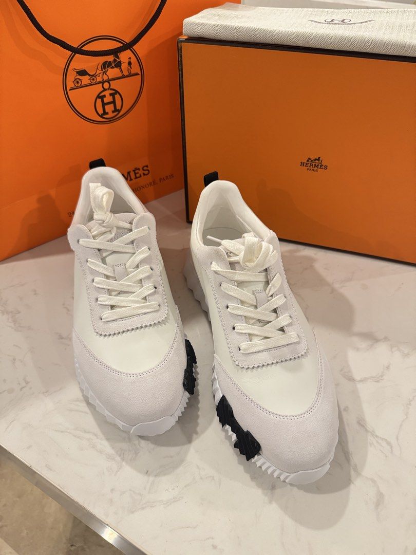 Hermes Bouncing Shoes (Category: Casual Shoes) located in Baguio. Submitted by justprei (Listing ID 1470722081, Image 2). Description: Hermes leather sneakers in white with suede details. Includes original orange box, dust bag, and paper shopping bag. Unworn condition, straight out of the box. Received as a gift..