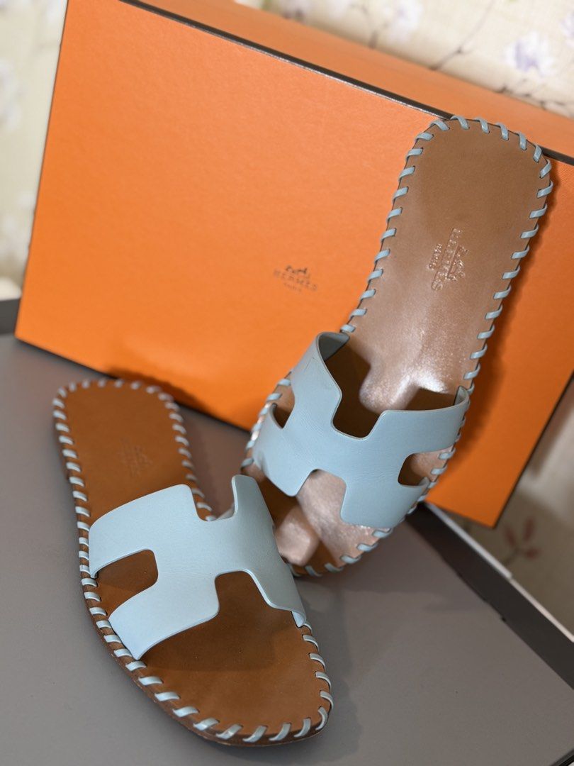Hermes Oran Braided (Category: Sneakers & Footwear) located in Mandaluyong City. Submitted by AvekLuxuriesPh2020 (Listing ID 1470583436, Image 2). Description: This is a pair of Hermès Oran Braided Sandals in a light pastel blue leather colorway (often referred to by the brand as Vert D’eau or Bleu Galet This particular variation is a limited or special edition of the classic Hermès Oran slide, featuring a distinct whipstitch braided detail along