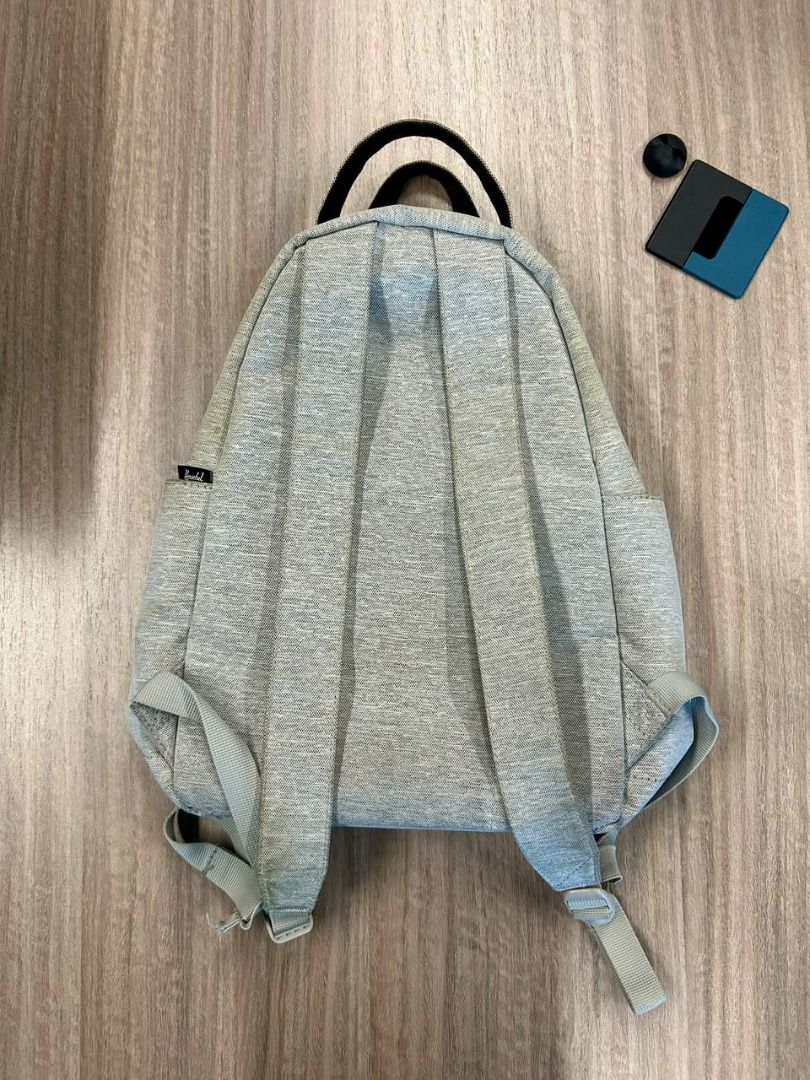 Herschel Grey and Pink Backpack (Category: Backpacks) located in Taguig. Submitted by thesleepypanda000 (Listing ID 1470580472, Image 2). Description: - Brand: Herschel (original) - Color: Heather grey with dusty pink front zip pocket - Features: Double top grab handles, adjustable shoulder straps, small front brand label - Condition: Clean interior and bottom base; no flaws but there are signs of usage and needs washing - Usage: Compact daily ba