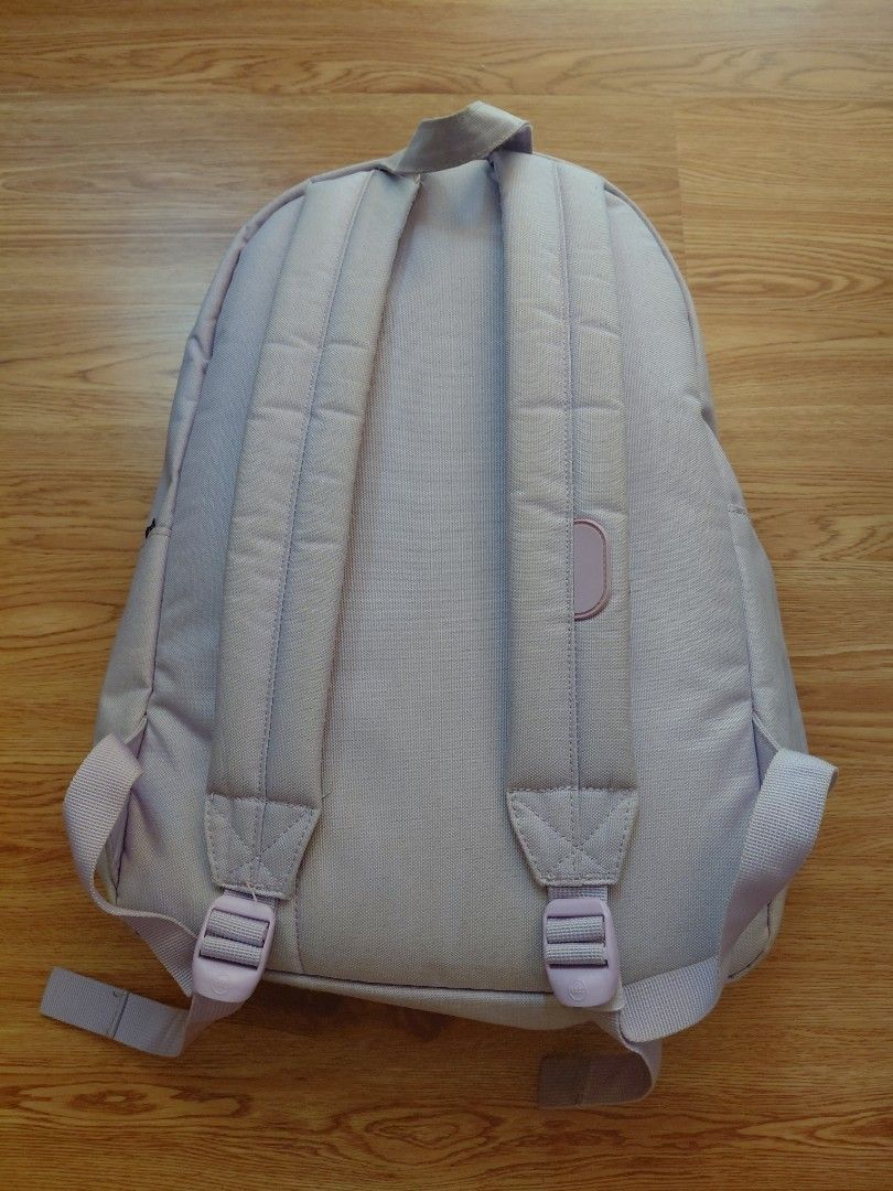 Herschel Supply Co. Light Purple Backpack (Category: Backpacks) located in Quezon City. Submitted by prelovedbythea19 (Listing ID 1470633083, Image 2). Description: - Brand: Herschel Supply Co. -24L - Color: Light purple with signature red and white striped interior lining - Features: Front zippered pocket and classic diamond patch detail - Comfort: Padded and adjustable shoulder straps - Storage: Clean interior with a convenient inner sleeve com