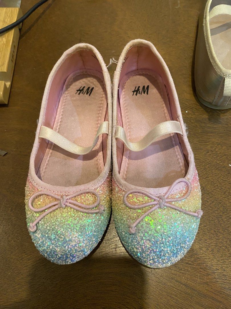 H&M Ballet Flats Bundle (Category: Babies & Kids Fashion) located in Santa Rosa. Submitted by hoardqueensdeclutter (Listing ID 1470676713, Image 3). Description: Bundle of three pairs of H&M kids ballet flats. Includes light blue glitter flats with Princess Jasmine insoles in size 27, multi-color rainbow glitter flats in size 26, and metallic gold flats. All feature elastic straps and front bows. Soles show minor scuffs and wear from normal use, 