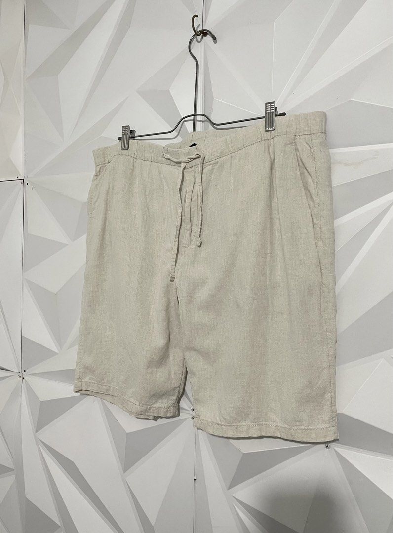 H&M Beige Linen Drawstring Shorts (Category: Swim Trunks & Board Shorts) located in Cabuyao City. Submitted by ParadisethriftedPh (Listing ID 1470648587, Image 3). Description: Cr: 9.5/10 Dimensions Waist: 40 Length: 20 - Color: Beige - Material: Lightweight linen, perfect for warm weather - Waistband: Elastic with adjustable drawstring and zip fly - Pockets: Deep front pockets and a single back pocket - Condition: Clean overall.