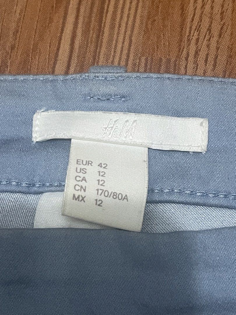 H&M Light Blue Casual Pants Size US 12 (Category: Jeans) located in Cainta. Submitted by nancygoreng (Listing ID 1470625376, Image 2). Description: - Brand: H&M - Color: Light blue - Size: US 12 / EUR 42 - Fit: Fitted waistband with belt loops and regular cut through the leg - Details: Trendy split hem at the ankle and a single back pocket - Condition: Clean fabric overall.