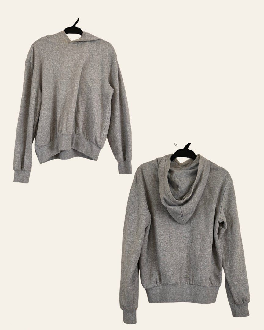 H&M Plain Grey Hoodie (Category: Hoodies) located in Paranaque City. Submitted by jackie.g (Listing ID 1470599636, Image 2). Description: - Brand/Model: H&M Pullover Hoodie - Color: Heather Grey - Features: Matching hood, front kangaroo pocket, ribbed cuffs and hem - Comfort: Soft inner fabric for warmth - Style: Versatile basic piece, easy to match with any casual outfit - Condition: Minor discoloration around neck area.