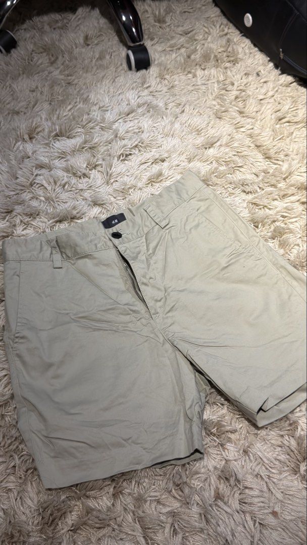 H&M Regular Fit Olive Green Shorts Size 28 (Category: Shorts) located in Manila. Submitted by kyle.daniel (Listing ID 1470650981, Image 1). Description: - Brand: H&M - Style: Regular fit casual shorts - Color: Khaki beige - Size: US 28 / EUR 28 - Closure: Standard button with zipped fly - Pockets: 2 front slip pockets, 2 buttoned back pockets - Condition: Excellent, clean with no stains or damage.