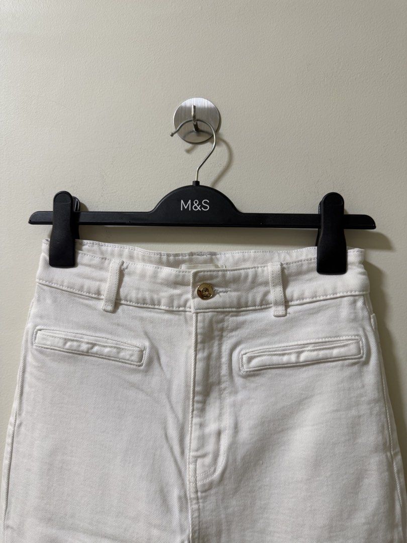H&M White Flared Denim Jeans Size (Category: Jeans) located in Makati City. Submitted by andzr. (Listing ID 1470643688, Image 2). Description: White denim trousers from H&M, size EUR 36 / US 4. Flared leg cut, front button closure, belt loops. With some black lines, idk if removable.