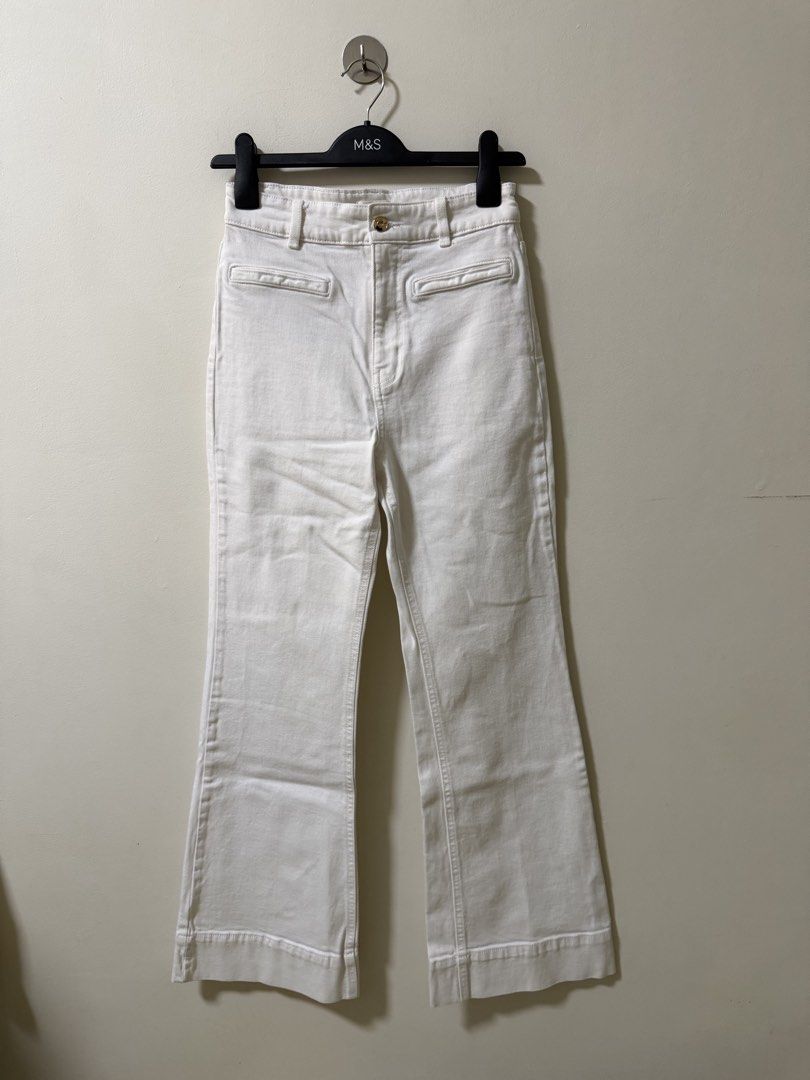 H&M White Flared Denim Jeans Size (Category: Jeans) located in Makati City. Submitted by andzr. (Listing ID 1470643688, Image 1). Description: White denim trousers from H&M, size EUR 36 / US 4. Flared leg cut, front button closure, belt loops. With some black lines, idk if removable.