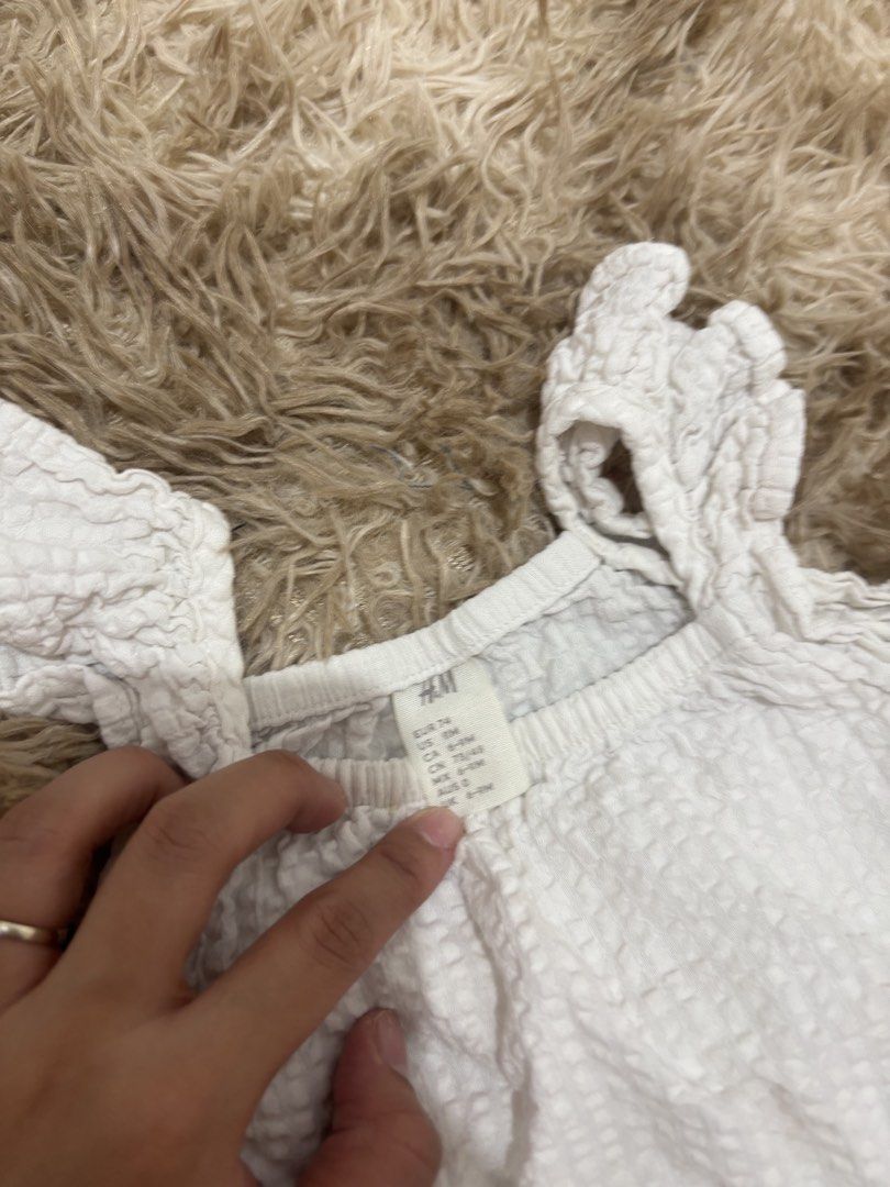 H&M White Ruffle Top and Shorts Set (Category: Sets or Coordinates) located in Bulacan. Submitted by ricammendz (Listing ID 1470730858, Image 2). Description: - Brand: H&M - Set: Matching top and shorts in crisp white - Material: Textured fabric - Top Details: Cute ruffle straps, relaxed fit - Shorts Details: Comfortable elastic waistband - Size: 6-8 months (EU 74) but can fit till 24m - Condition: Clean and ready for your little one - Perfect fo