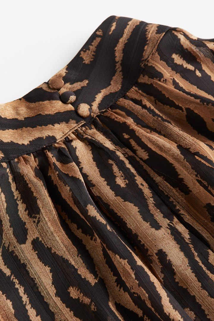 H&M Zebra Print High-Neck Longsleeves (Category: Blouses) located in Quezon City. Submitted by dropdeadprices (Listing ID 1470630872, Image 2). Description: - Brand: H&M New and unused and still in the hm website; only removed tags - Print: Brown and black zebra print - Size: EUR S / US S - Details: High neckline with back button closure, long sleeves with buttoned cuffs 21 inches pit to pit when laid flat x 25 inches length.