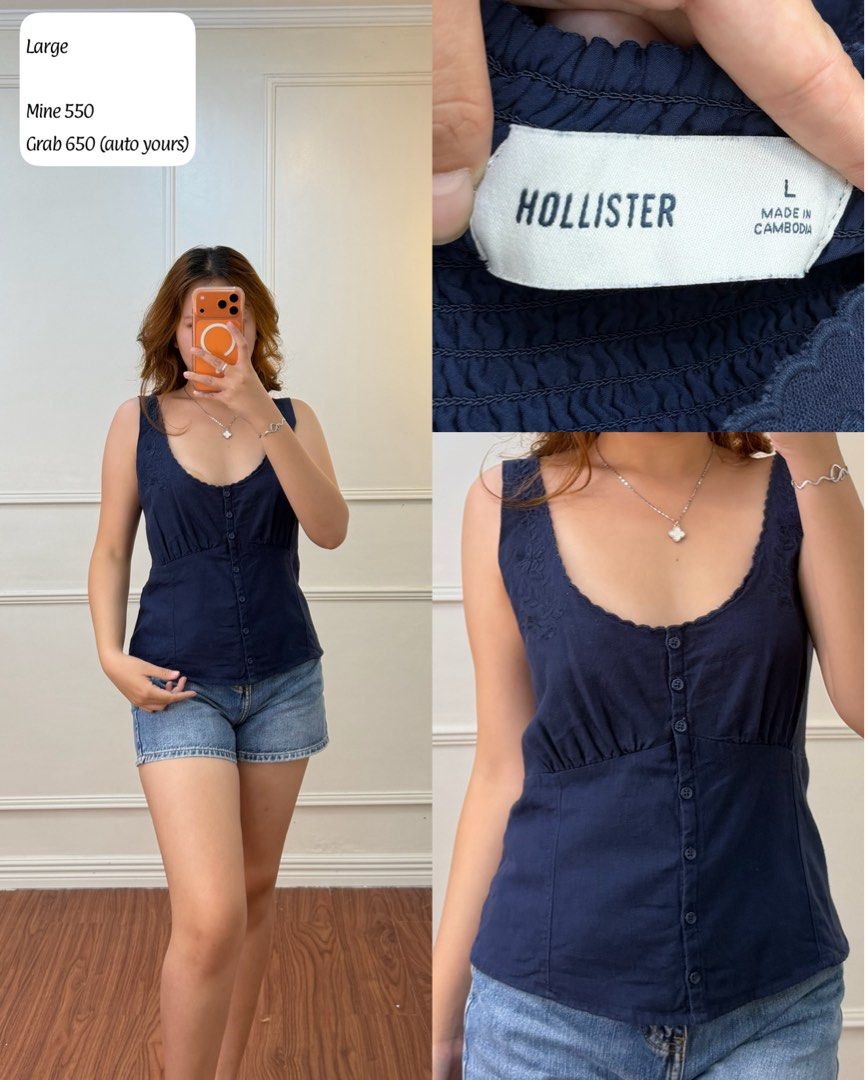 Hollister Navy Blue Sleeveless Button-Front Top (Category: Sleeveless) located in Manila. Submitted by angelll0123 (Listing ID 1470678872, Image 1). Description: - Brand: Hollister - Size: Large - Color: Navy blue - Style: Sleeveless top with scoop neckline - Details: Subtle embroidered accent, functional front button-down row, and a flattering gathered bust design - Origin: Made in Cambodia.