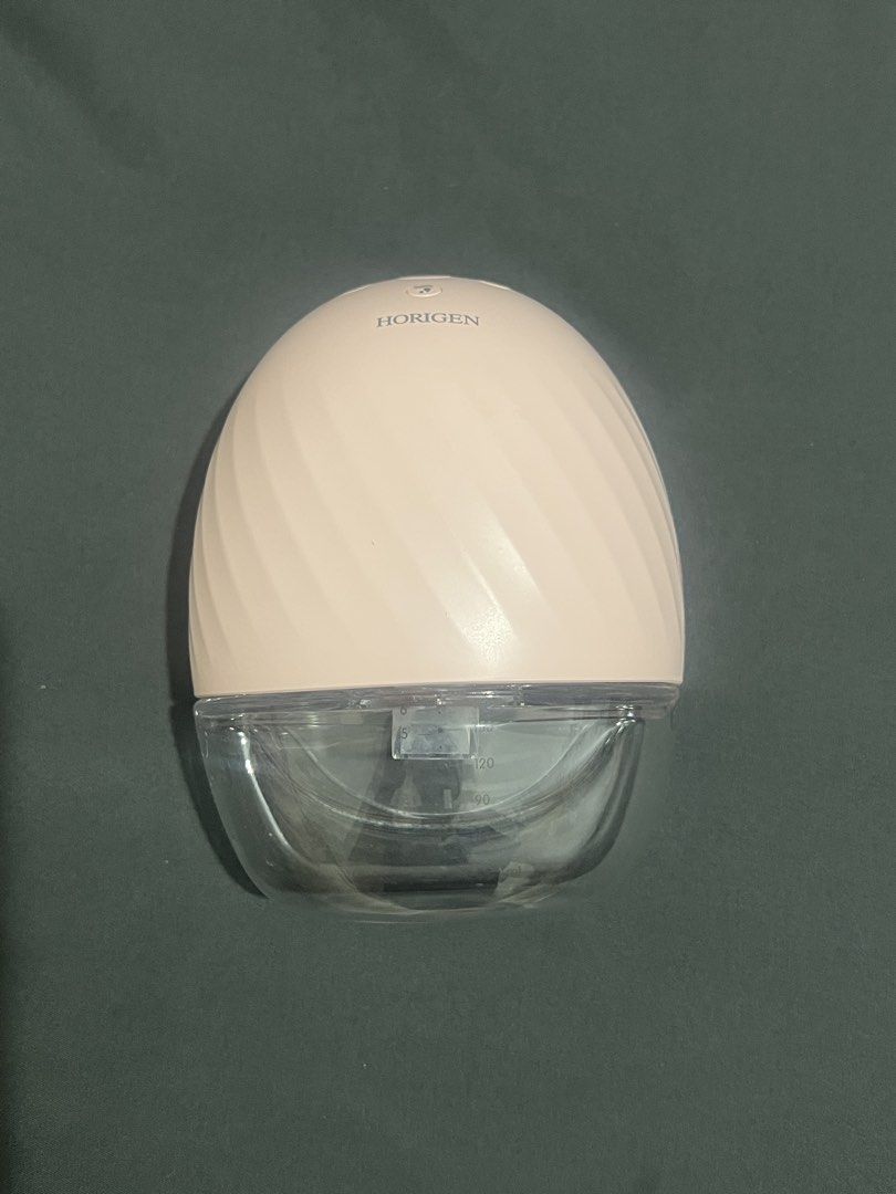 Horigen Portable Electric Breast Pump - Pink 1 pc (Category: Breastfeeding & Bottle Feeding) located in Manila. Submitted by myrs23 (Listing ID 1470683997, Image 3). Description: Tried only thrice (cant produce milk so i gave up pumping 😫) The spare parts are unused (the ones inside the sealed plastic) - Brand: Horigen Electric Breast Pump - Color: Pink - Flange Size: 25mm - Includes: Motor unit, collection cup, funnel, valve, and sealed spare a
