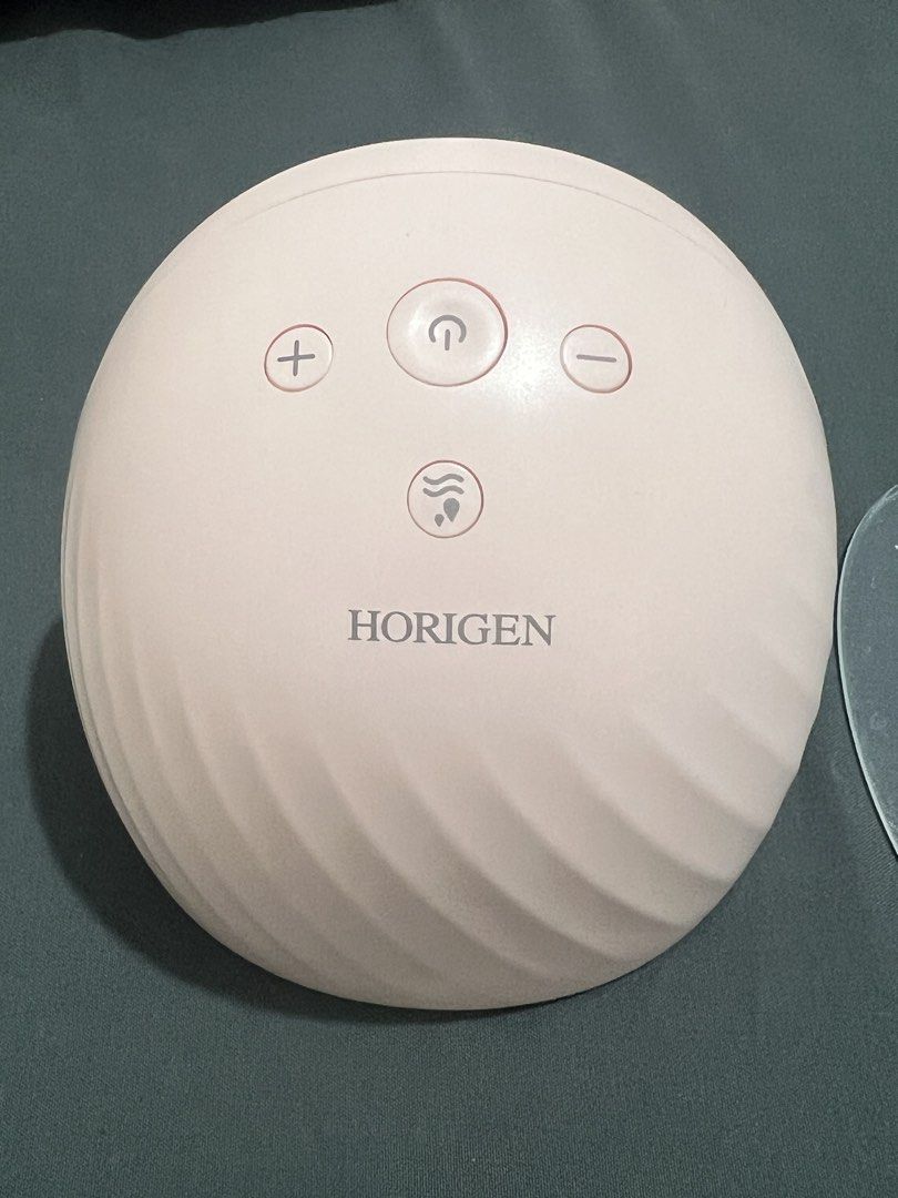 Horigen Portable Electric Breast Pump - Pink 1 pc (Category: Breastfeeding & Bottle Feeding) located in Manila. Submitted by myrs23 (Listing ID 1470683997, Image 1). Description: Tried only thrice (cant produce milk so i gave up pumping 😫) The spare parts are unused (the ones inside the sealed plastic) - Brand: Horigen Electric Breast Pump - Color: Pink - Flange Size: 25mm - Includes: Motor unit, collection cup, funnel, valve, and sealed spare a