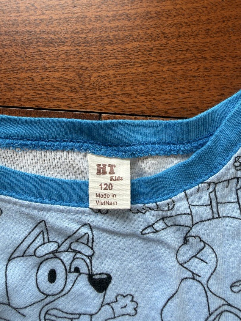 HT Kids Bluey Character Pajama Set Size 120 (Category: Babies & Kids Fashion) located in Makati City. Submitted by juju_08 (Listing ID 1470569232, Image 2). Description: - Design: Light blue with all-over Bluey character line art print - Top: Long sleeves with bright blue ribbed cuffs - Bottoms: Matching pants with elastic waistband and ribbed ankle cuffs - Sizing: Tagged Size 120 - Origin: Made in Vietnam - Condition: Brand new and high quality 