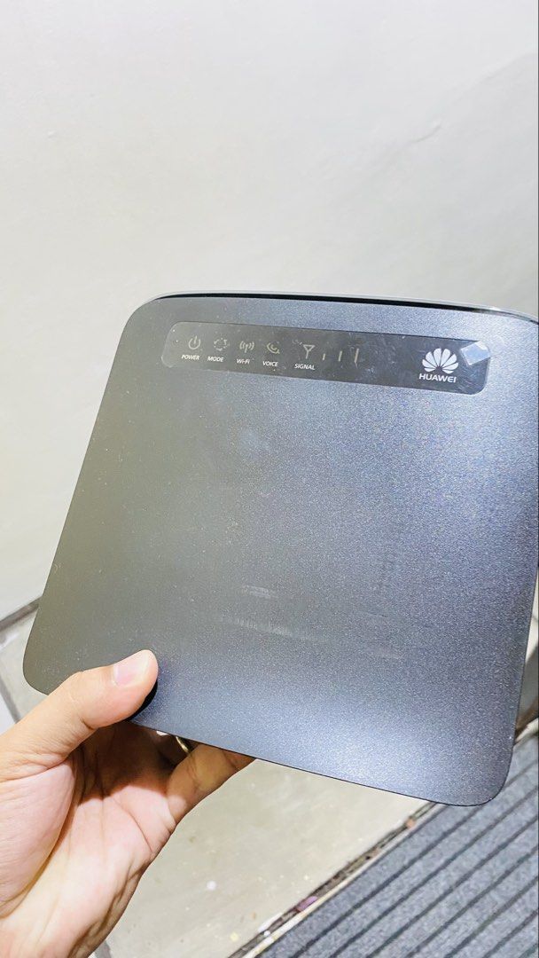 Huawei LTE CPE E5186s - 22a Router (Category: Networking) located in Manila. Submitted by boldfire_5aad05 (Listing ID 1470714079, Image 3). Description: - Model: Huawei LTE CPE E5186 Router (Black) - Condition: Powers on and works great for home networks - Inclusions: Original box and power adapter - Features: Multiple LAN ports, telephone ports, side SIM card slot, rear external antenna connectors, and power switch - Perfect for boosting home or