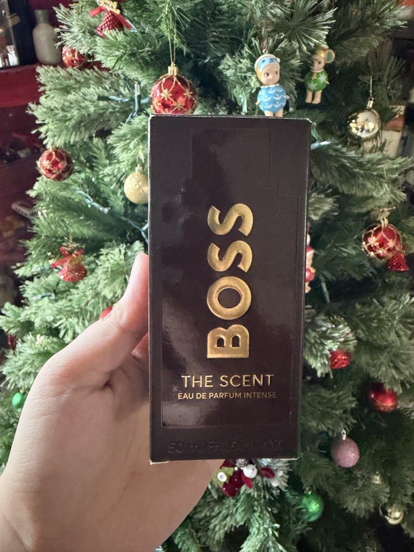 Hugo Boss The Scent Eau De Parfum Intense 50ml (Category: Fragrance & Deodorants) located in Agdangan. Submitted by maomao03302 (Listing ID 1470632297, Image 1). Description: - Hugo Boss The Scent Eau de Parfum Intense for men - Size: 50ml bottle - Scent Profile: Ambery fruity gourmand with notes of manika and amber accord - Condition: Like new, sprayed only a few times to test (bottle is essentially full) - Inclusions: Original packaging box inc