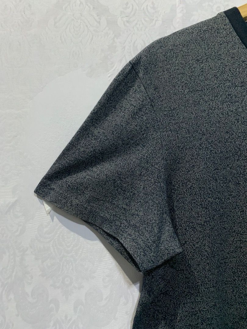 Hugo Boss T-Shirt Grey Size M (Category: Tshirts & Polo Shirts ) located in Lucban. Submitted by mysticshark.0f6e1d (Listing ID 1470648566, Image 2). Description: - Brand: Hugo Boss - Style: Crew neck t-shirt with short sleeves - Color: Heather grey with contrast dark collar and hem trim - Size: Medium (M tag at neck) - Details: Includes interior Hugo Boss branding and material care labels - Condition: Brand new / Excellent quality.
