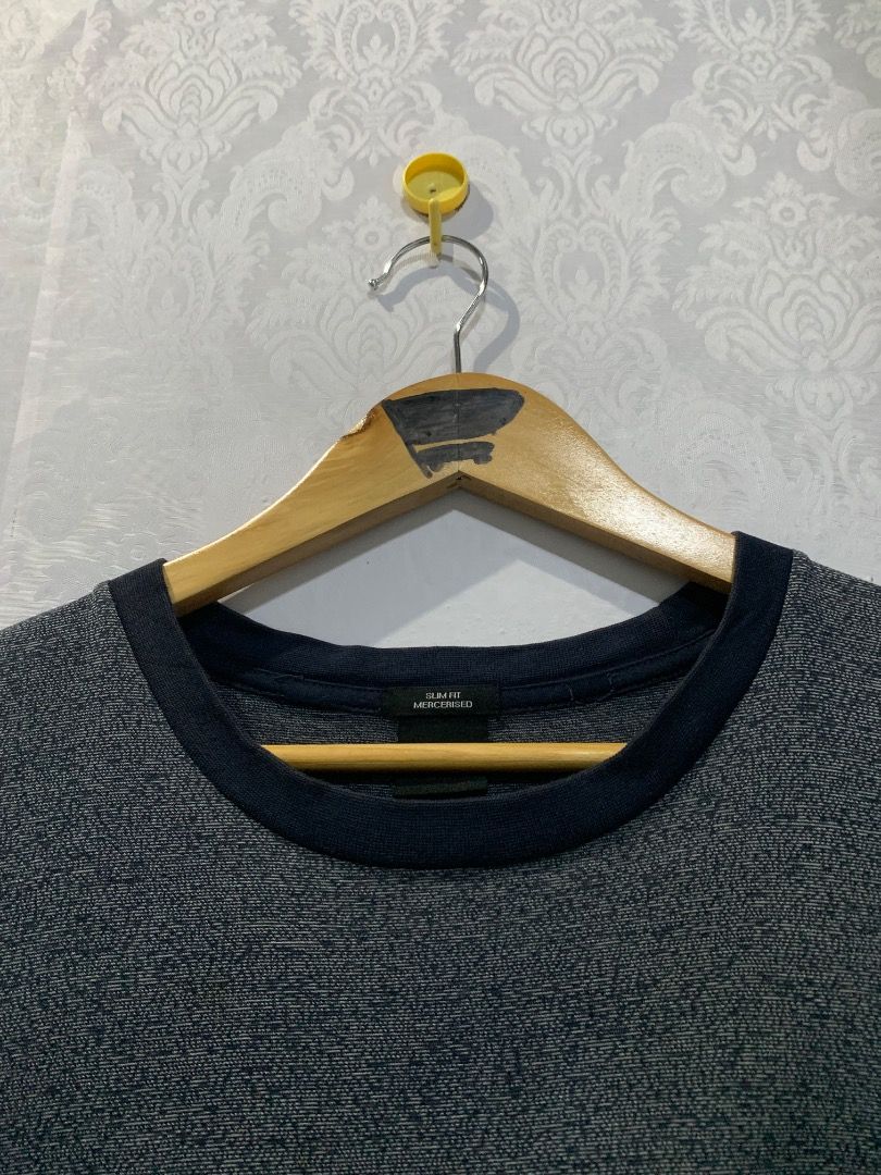 Hugo Boss T-Shirt Grey Size M (Category: Tshirts & Polo Shirts ) located in Lucban. Submitted by mysticshark.0f6e1d (Listing ID 1470648566, Image 3). Description: - Brand: Hugo Boss - Style: Crew neck t-shirt with short sleeves - Color: Heather grey with contrast dark collar and hem trim - Size: Medium (M tag at neck) - Details: Includes interior Hugo Boss branding and material care labels - Condition: Brand new / Excellent quality.