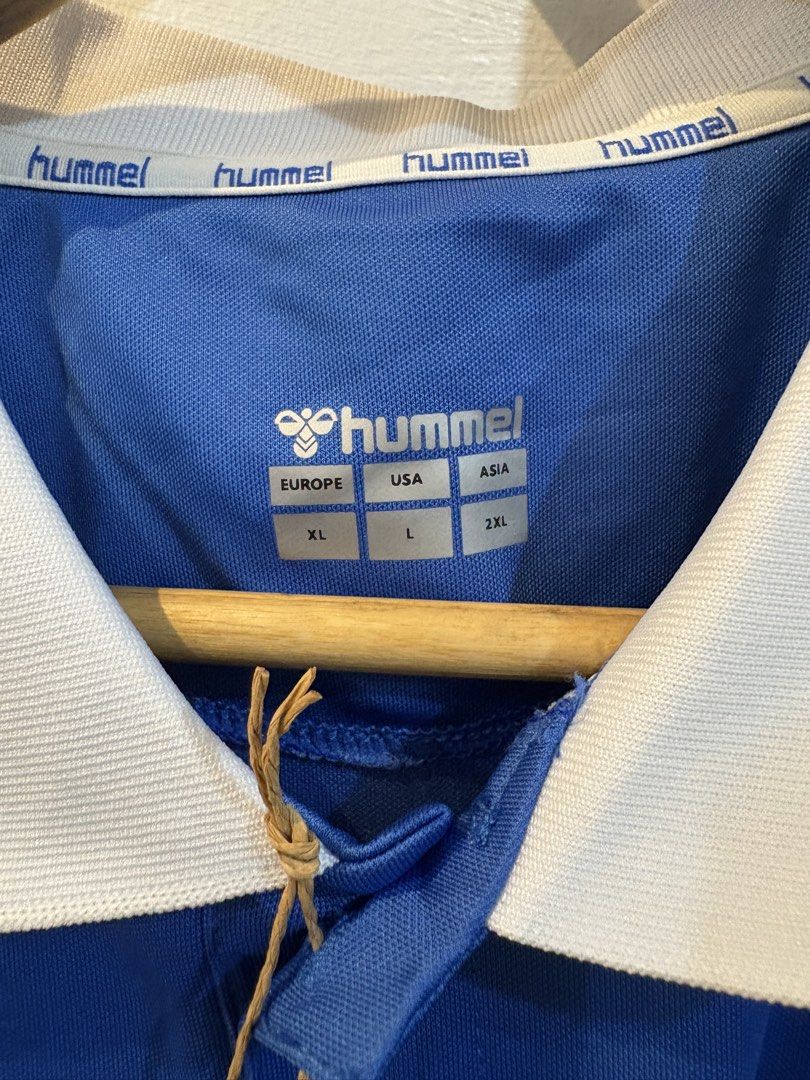Hummel Everton Home Jersey (Category: Tshirts & Polo Shirts ) located in Echague. Submitted by jake_rc (Listing ID 1470626366, Image 2). Description: Hummel Everton Home Jersey from the 2023–2024 Premier League season, featuring the blue base, white-and-blue patterned polo collar, Hummel chevrons on the shoulders, and the Stake.com sponsor logo. Size US Large Dimes 21 x 28.5 Issue: washable dot stains / 2ndot like lints Price 950 plus SF.