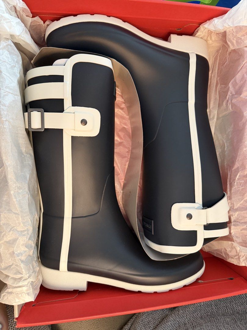 Hunter Original Rain Boots Navy White UK4 EU37 US6 (Category: Boots) located in Makati City. Submitted by marowebg (Listing ID 1470569444, Image 2). Description: - Brand: Hunter Slim Fit Short Contrast - Color: Navy with white trim, straps, and lug sole - Size: UK4 / EU37 / US6 - Condition: Brand new in original red box with tissue paper - Features: Adjustable side buckle, chunky lug sole, red logo heel detail.