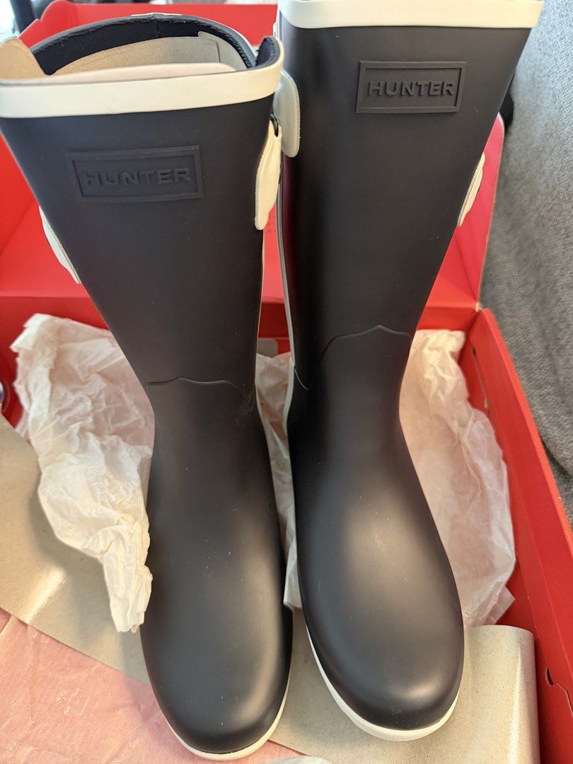 Hunter Original Rain Boots Navy White UK4 EU37 US6 (Category: Boots) located in Makati City. Submitted by marowebg (Listing ID 1470569444, Image 1). Description: - Brand: Hunter Slim Fit Short Contrast - Color: Navy with white trim, straps, and lug sole - Size: UK4 / EU37 / US6 - Condition: Brand new in original red box with tissue paper - Features: Adjustable side buckle, chunky lug sole, red logo heel detail.