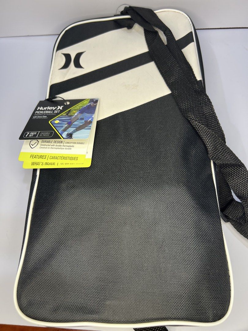 Hurley 7-Piece Pickleball Set with Carry Case (Category: Racket and Ball Sports) located in Quezon City. Submitted by gigisantos (Listing ID 1470623996, Image 3). Description: - Brand: Hurley (Original tags still attached on the strap) - Set Type: Complete 7-piece pickleball set - Paddle: 1x turquoise paddle with great control and feel - Balls: 4x durable yellow pickleballs included - Bag: 1x black-and-white shoulder carry case featuring a handy 