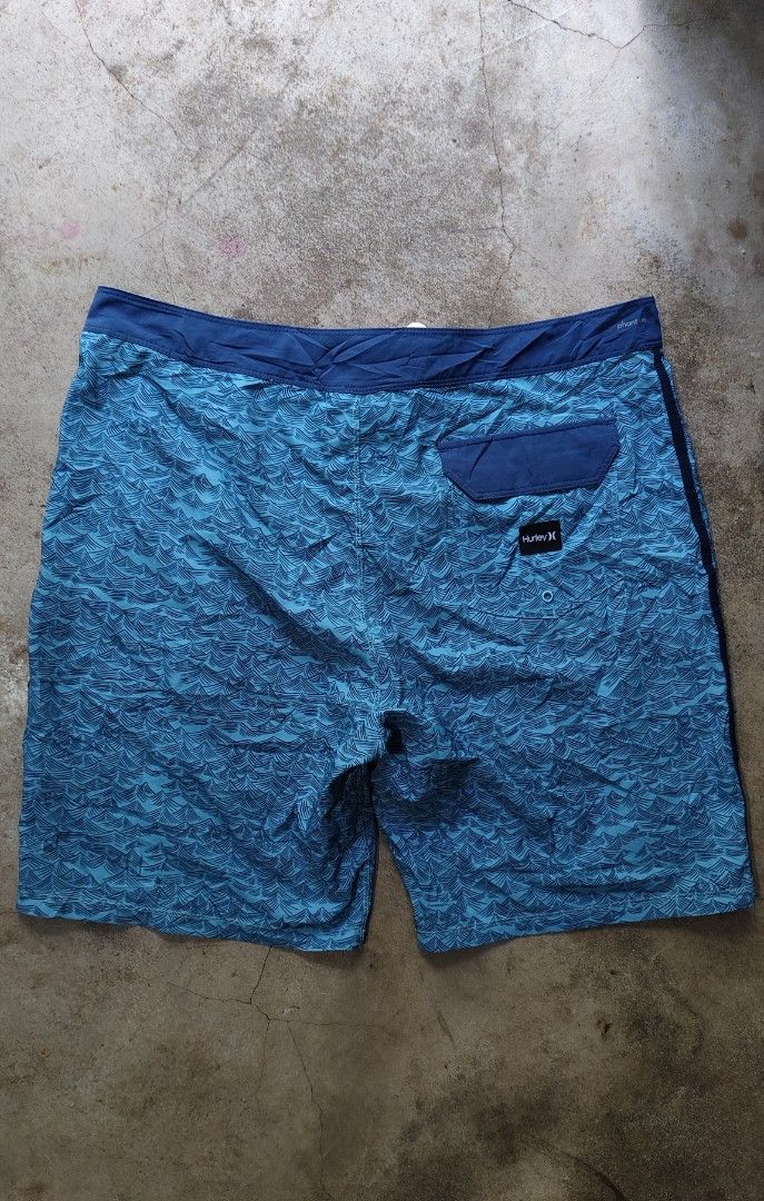 Hurley Phantom Blue Wave Print Boardshorts Size 36 (Category: Swim Trunks & Board Shorts) located in Quezon City. Submitted by truedeer_cda94c (Listing ID 1470605158, Image 2). Description: - Brand: Hurley - Color: Blue with all-over wave pattern - Size: 36 waist - Length: 21 inches - Closure: Front drawstring - Pockets: Back pocket with velcro flap and brand patch - Details: Round Hurley logo patch on left leg and clean interior tags - Condition